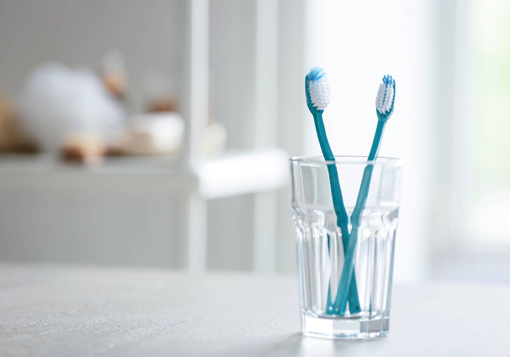 Toothbrushes in glass