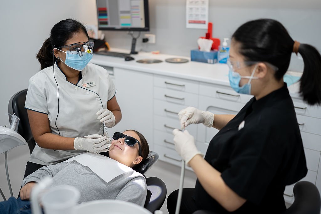 Passionate and experienced dentist providing personalised care to a patient at Dentist at Underwood